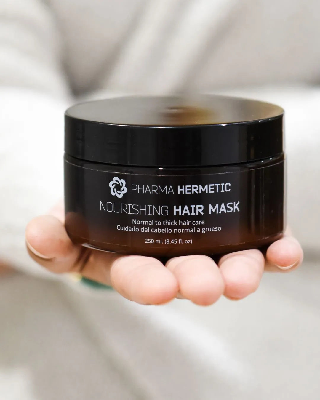 Nourishing Hair Mask held in the hand